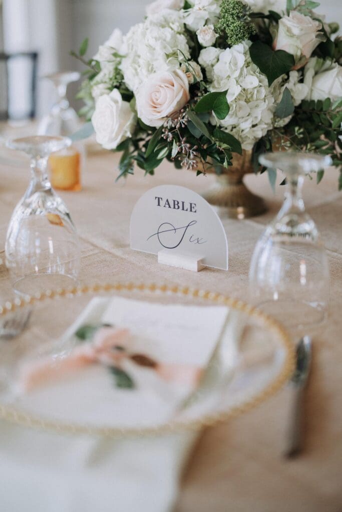 Blush and ivory rose wedding centerpiece on reception table at TPC Sugarloaf in Duluth Georgia