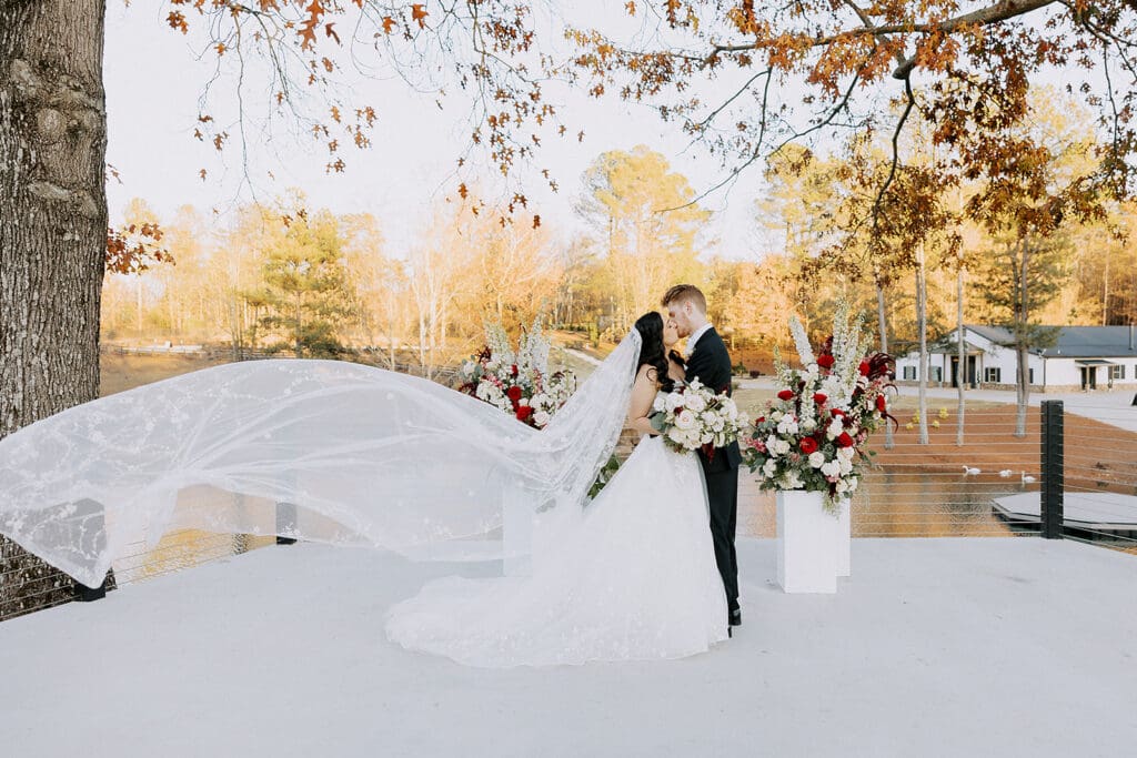 Burgundy and ivory ceremony florals for winter wedding at The Revere