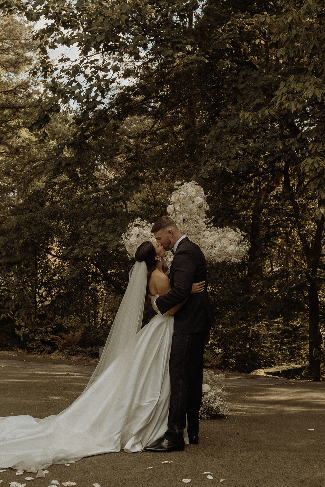 Elegant outdoor wedding ceremony with floral cross installation at Country Club of the South in Johns Creek Georgia