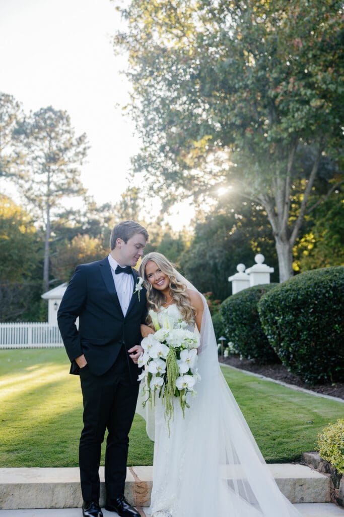 Cascading white orchid bridal bouquet at Greenfield Farms wedding in Cumming Georgia