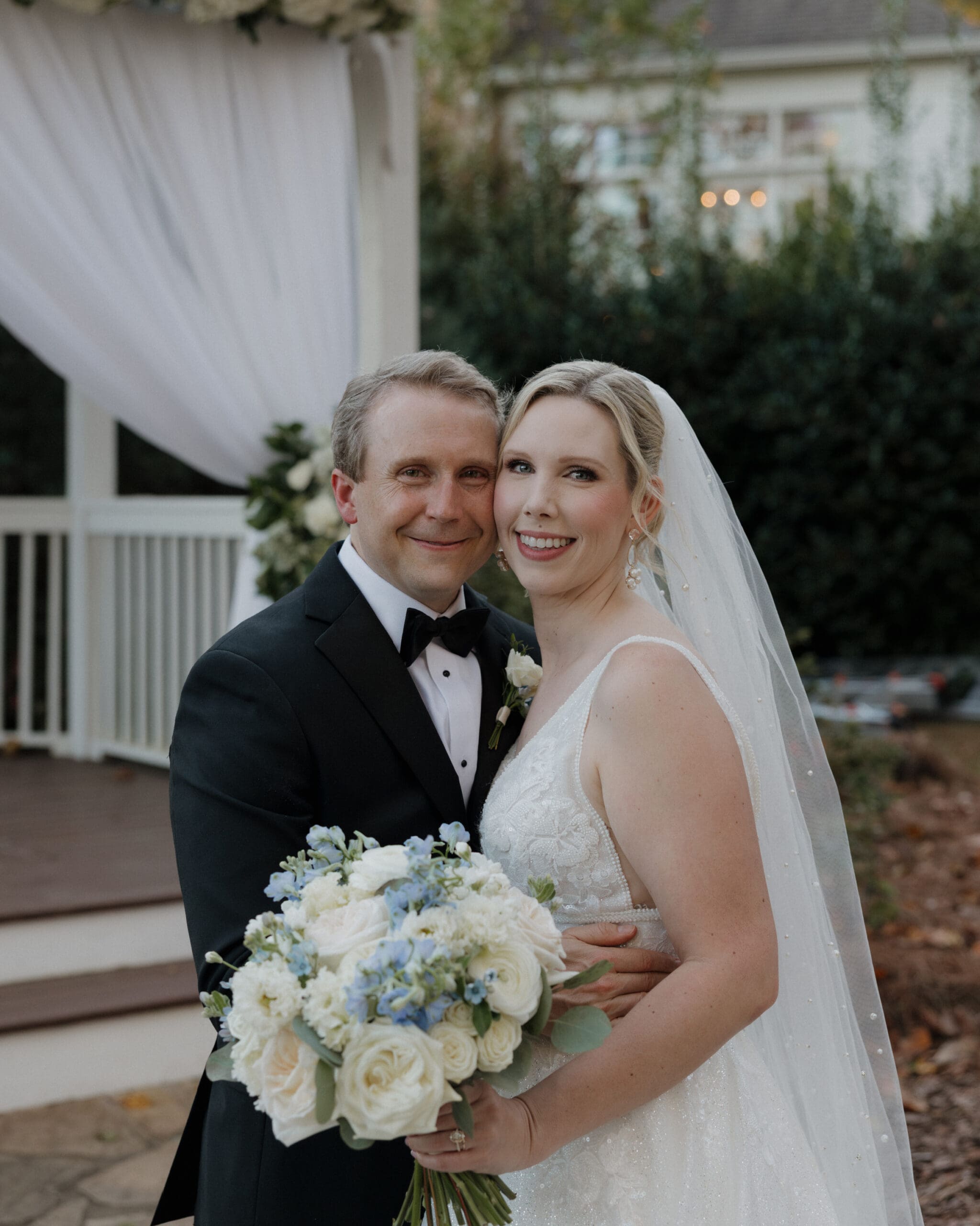 Bride and groom portraits at Little River Farms with White and Blue Bouquet