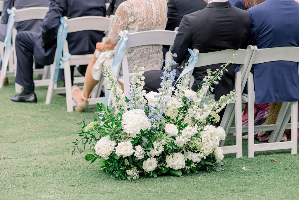 Ground meadow line the ceremony aisle at TPC Sugarloaf wedding 
