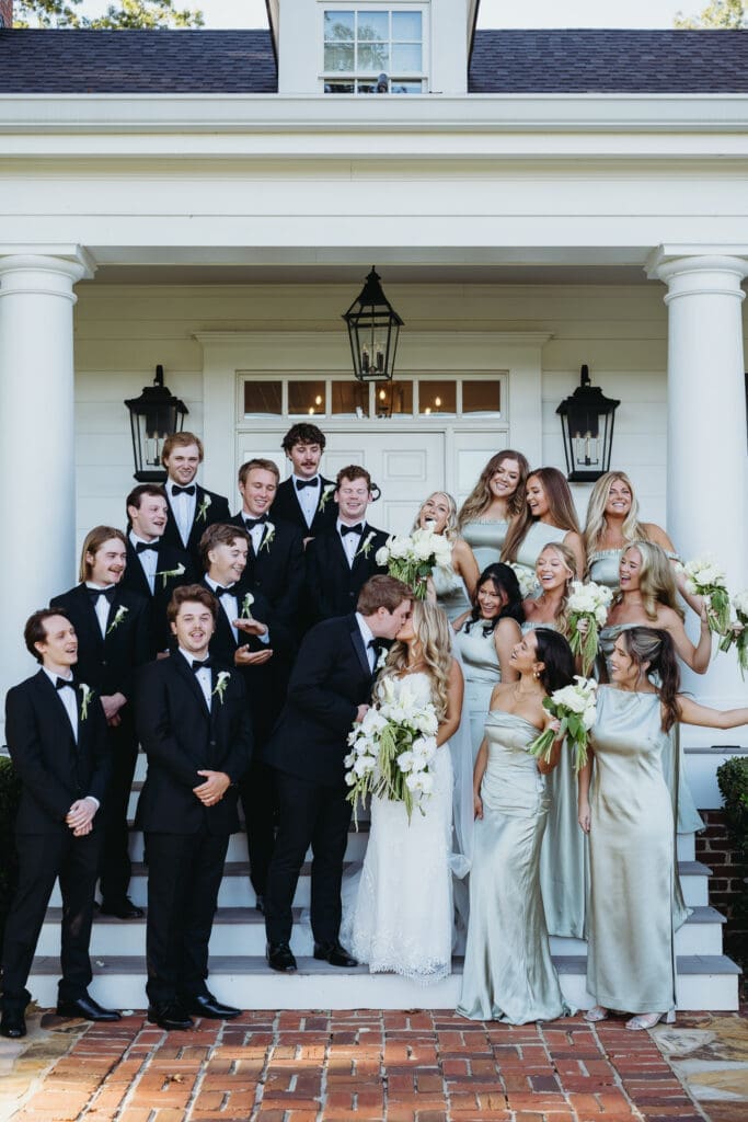 Cascading white orchids and garden roses designed for a luxury wedding at Greenfield Farms in Cumming, Georgia.