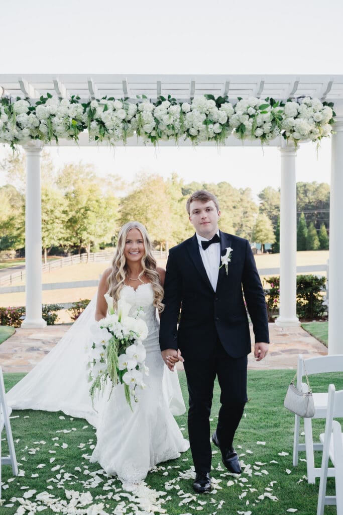 Rose petal aisle at outdoor ceremony at Greenfield Farms in Cumming Georgia