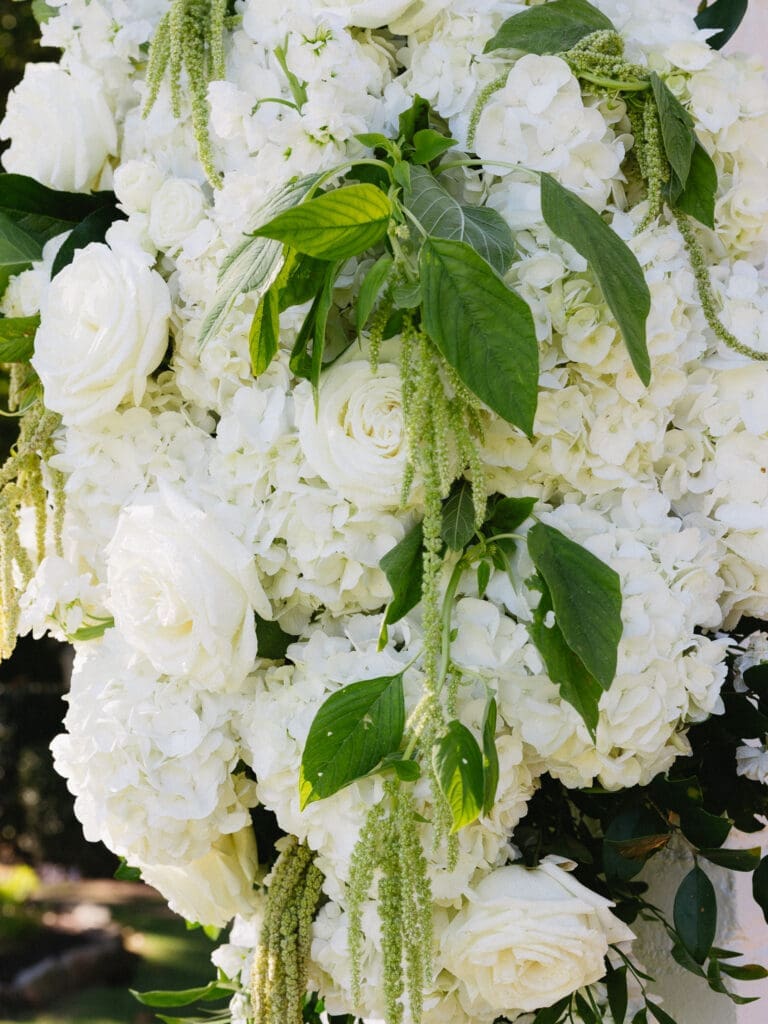 Garden-inspired ceremony florals featuring hydrangea and roses at Greenfield Farms, a North Georgia wedding venue.