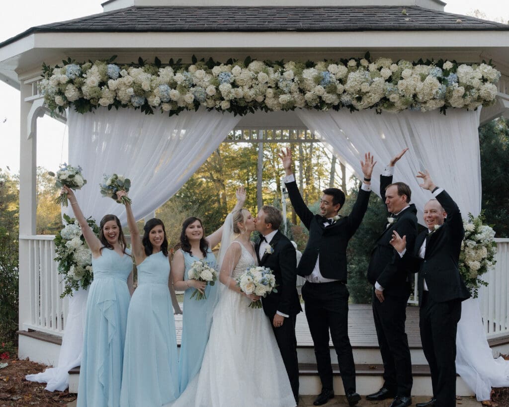White and blue floral gazebo ceremony at Little River Farms in North Georgia designed by a luxury wedding florist