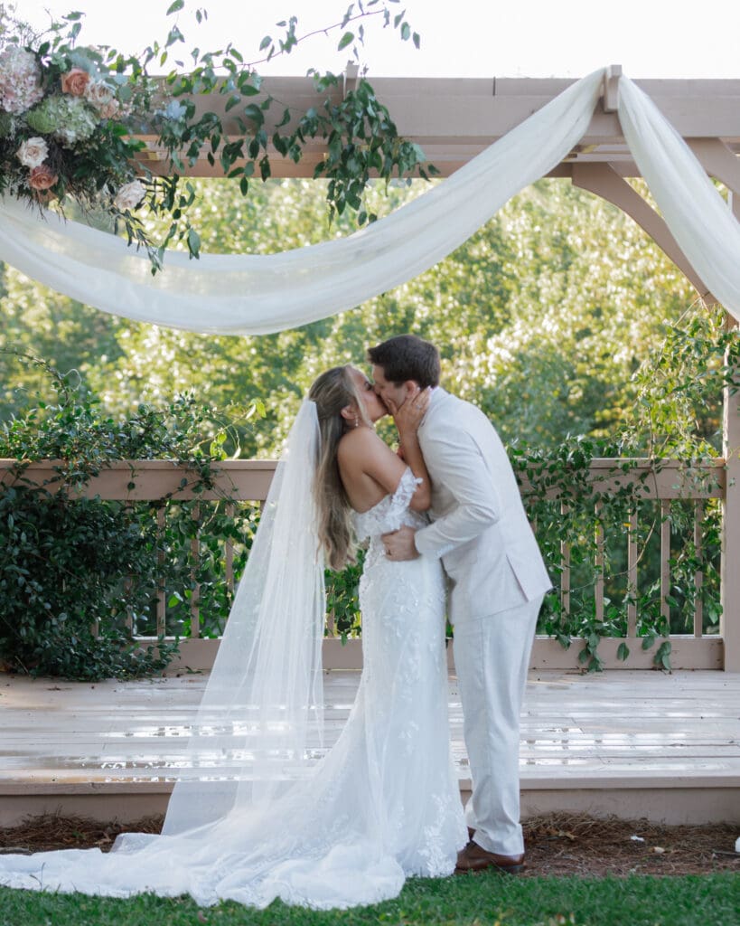 Romantic draped arbor at White Oaks Vineyard Wedding 