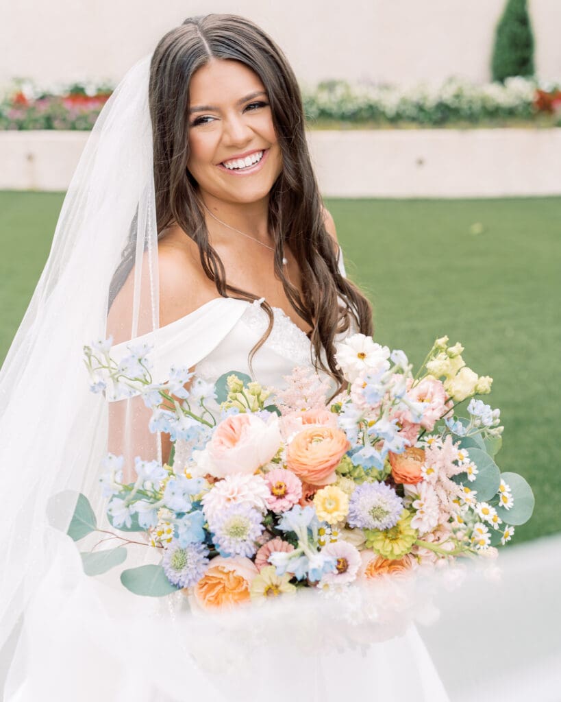 Bride portrait with colorful garden style bouquet at The Revere