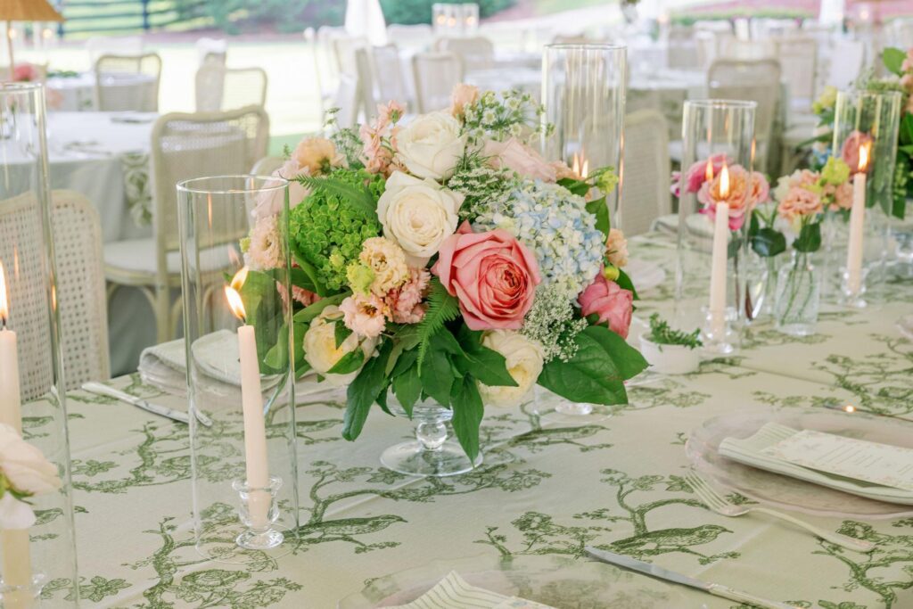 Reception table with colorful florals at Greenfield Farm.