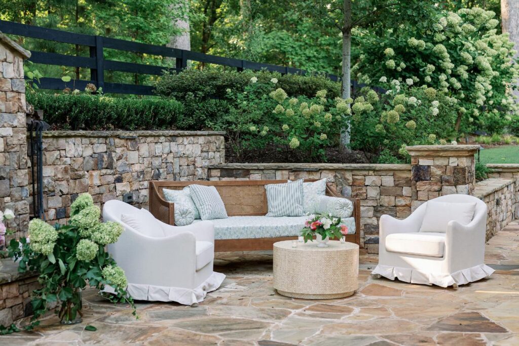 Outdoor wedding lounge seating area with floral accents at Greenfield Farm