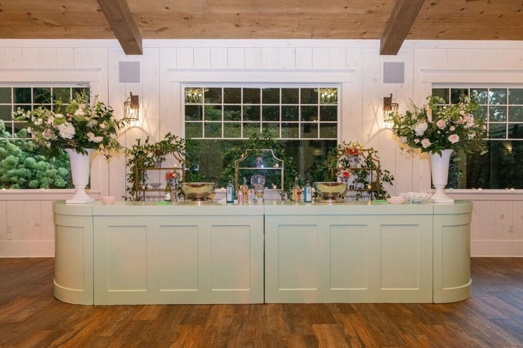 Custom decorated cocktail bar setup during outdoor wedding at Greenfield Farms