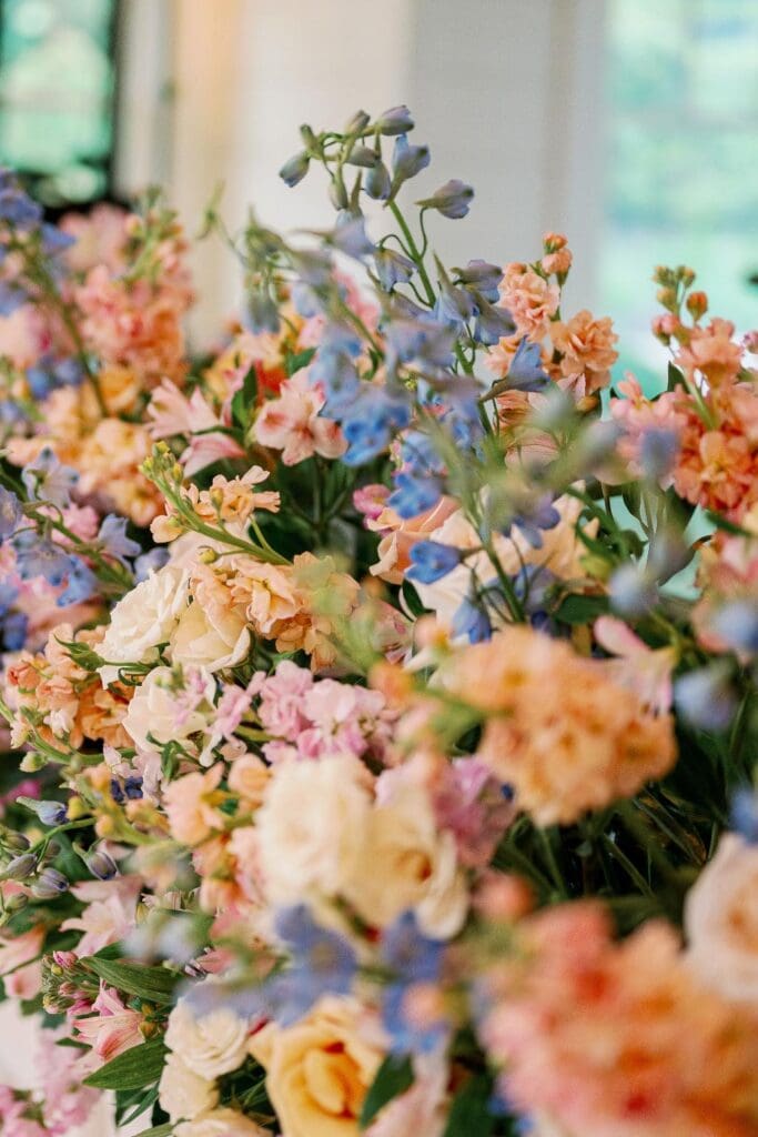 Close up of pastel wedding flowers used in Greenfield Farms reception floral design