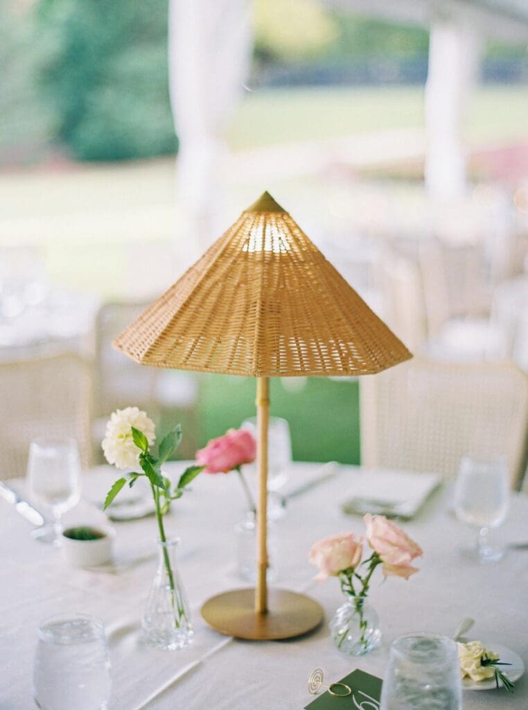 Garden style wedding table with woven lamp centerpiece and bud vases at Greenfield Farms wedding in North Georgia
